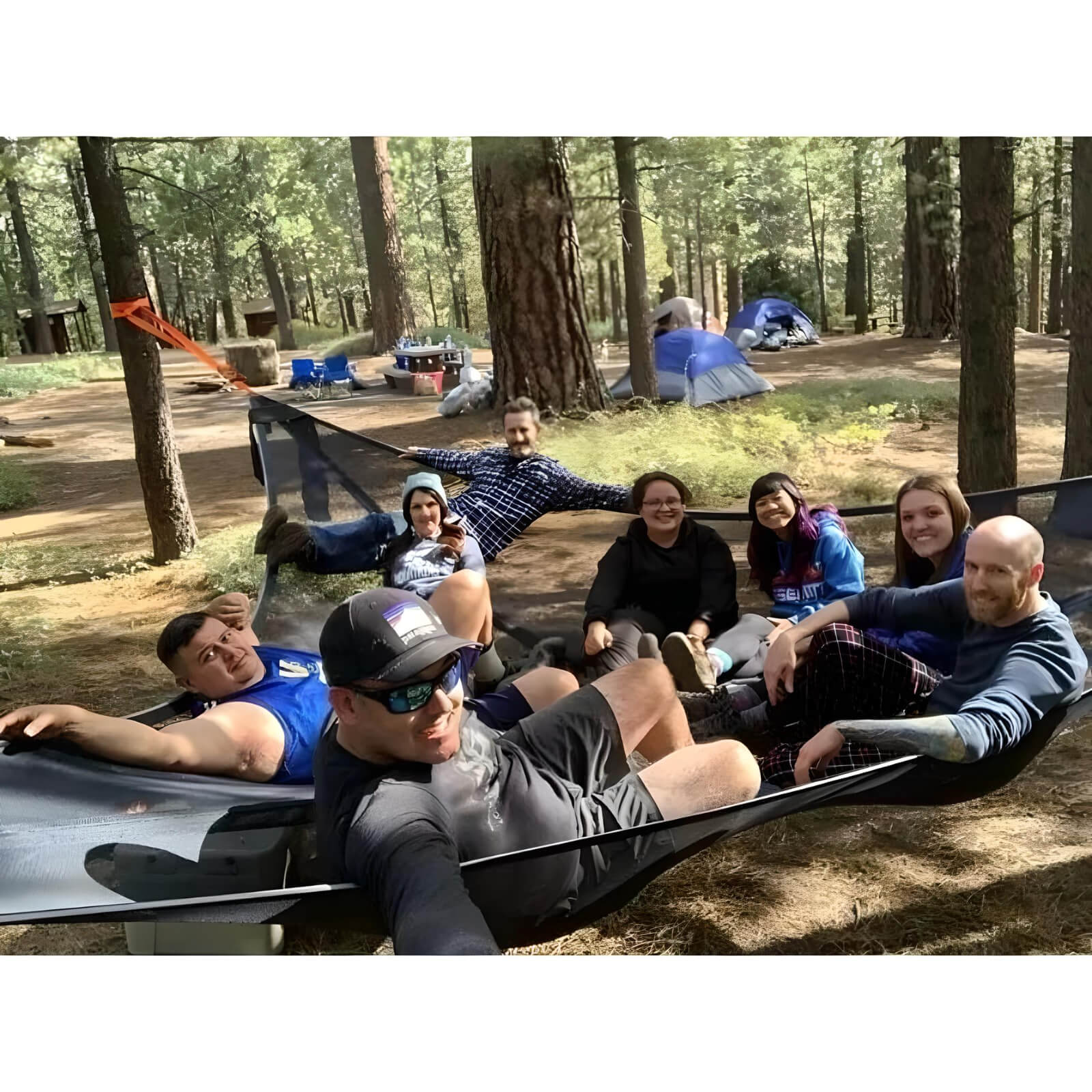 2-Person-Tree-Tent-group-sitting-in-hammock