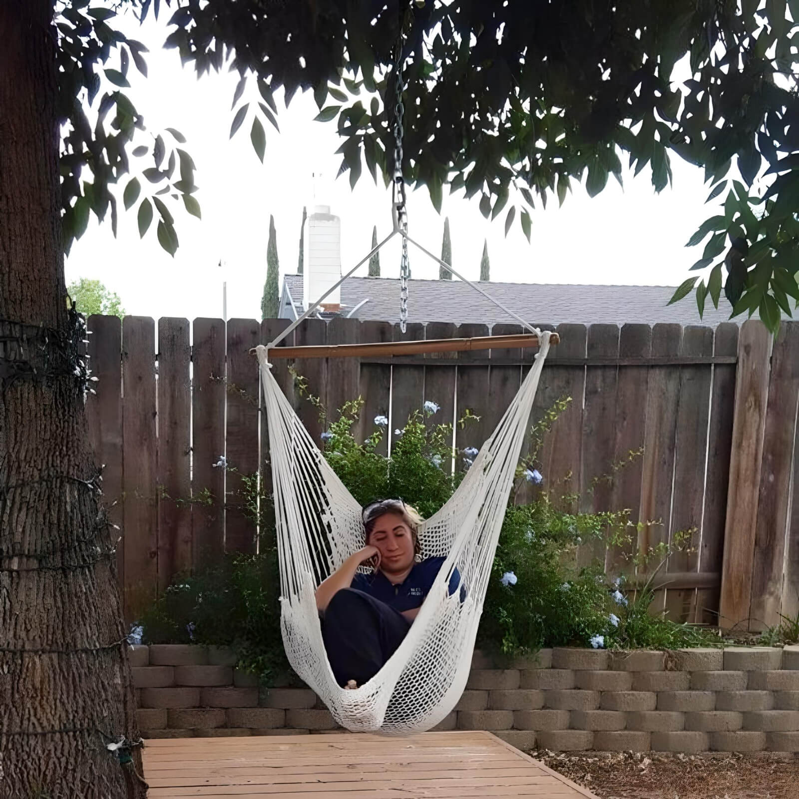 Copy-of-a-women-sleeping-on-a-large-hammock-swing