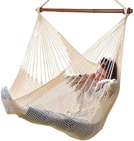 girl-sitting-on-hanging-hammock-chair-indoor