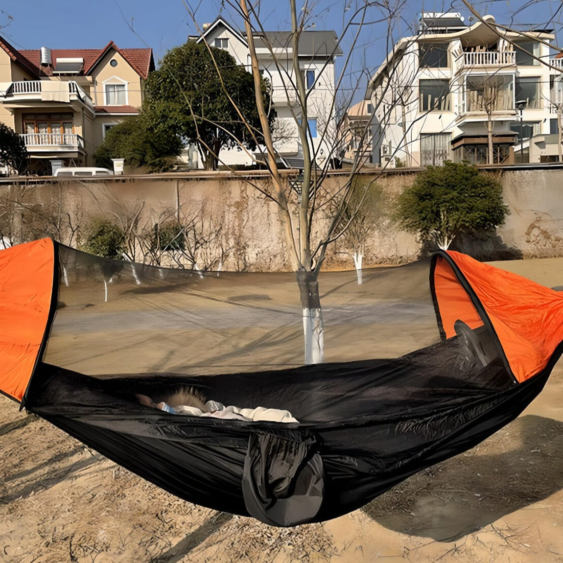   a-girl-sleeping-on-a-tent-hammock
