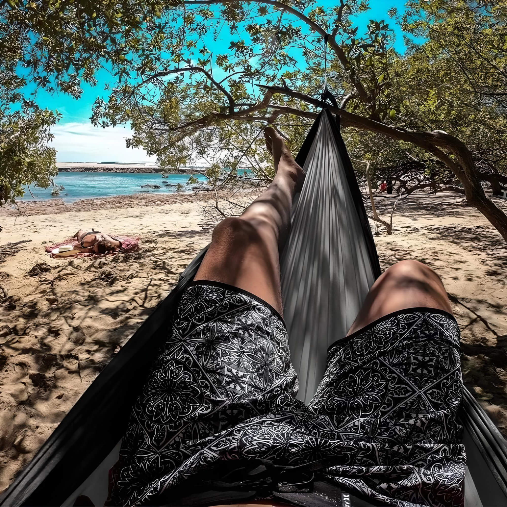 hammock-with-mosquito-net-and-rainfly-boy-laying-in-hammock
