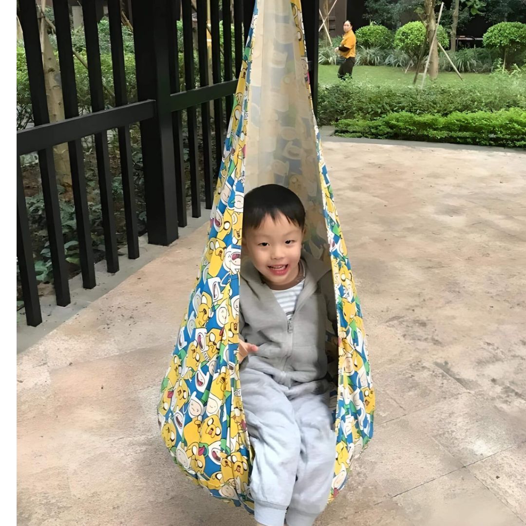 pod-swing-chair-sitting-on-child