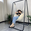 girl-sitting-on-single-hammock-chair-stand